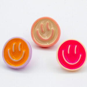 Broches smiley roze